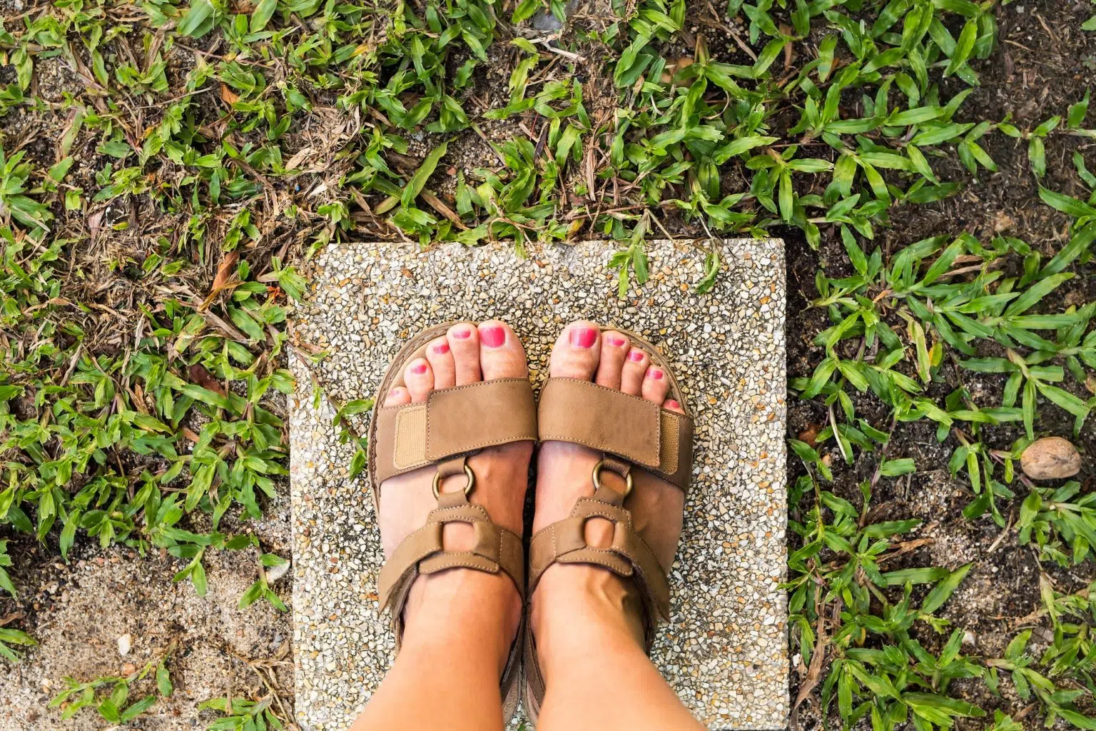 feet selfie from upper view of a woman traveler in sandal