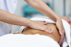 woman having abdomen massage by professional osteopathy therapis 1536x1025.jpg